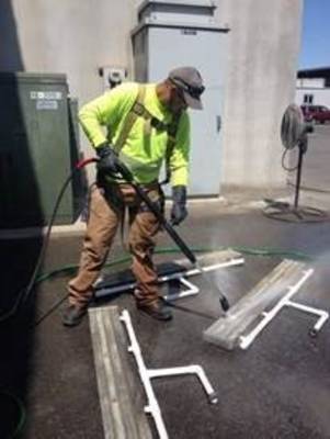 Pressure washing drain pans